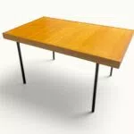 Table à manger extensible ARP Guariche Mortier Motte éditée par Minvielle vers 1960 plaqué frêne piètement métal laqué noir
