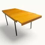 Table à manger extensible ARP Guariche Mortier Motte éditée par Minvielle vers 1960 plaqué frêne piètement métal laqué noir