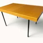 Table à manger extensible ARP Guariche Mortier Motte éditée par Minvielle vers 1960 plaqué frêne piètement métal laqué noir