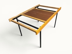 Table à manger extensible ARP Guariche Mortier Motte éditée par Minvielle vers 1960 plaqué frêne piètement métal laqué noir